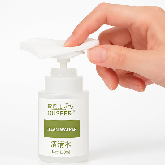 Hand holding a bottle labeled 'Ouseer Clean Water' on a white background